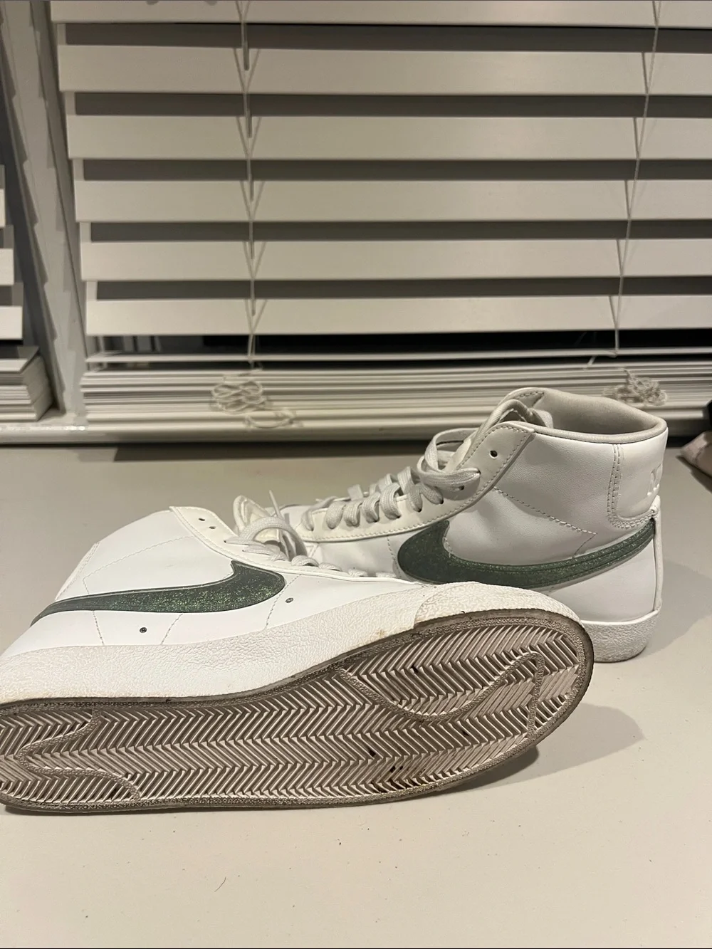 Nike White High-Top Sneakers with Green Swoosh Accent
